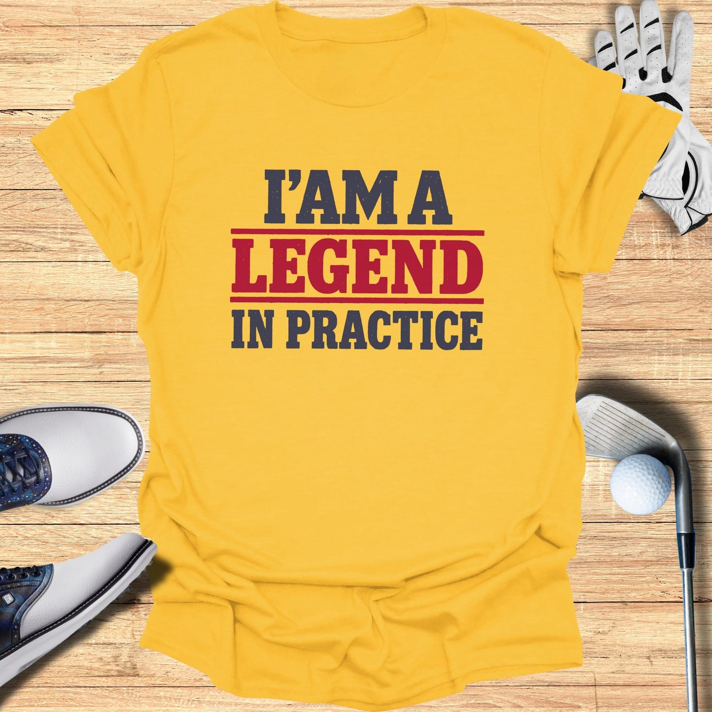 Yellow t-shirt with "I'M A LEGEND IN PRACTICE" in red and blue text.