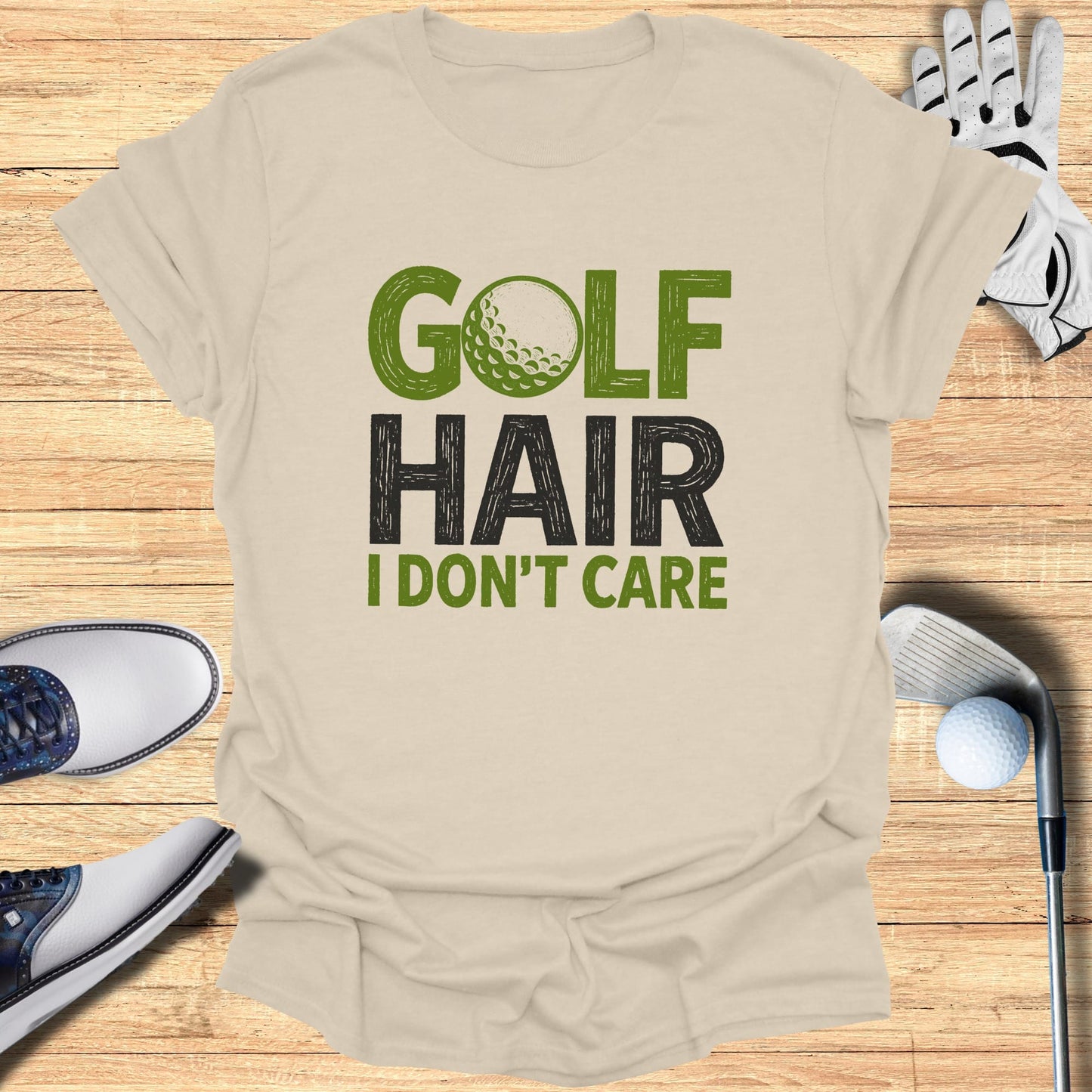 T-shirt with "GOLF HAIR I DON'T CARE" text and golf accessories.
