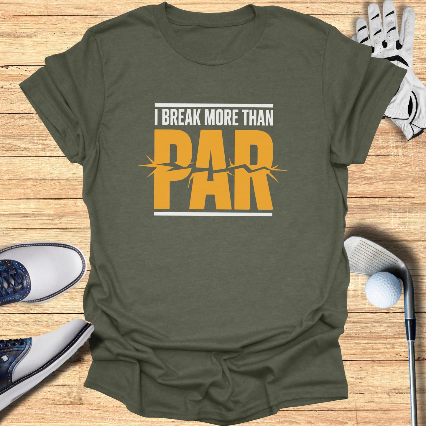 Olive t-shirt with "I Break More Than PAR" text and golf accessories.