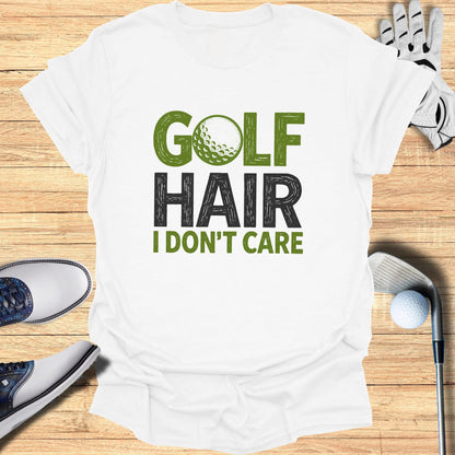 White t-shirt with "GOLF HAIR I DON'T CARE" graphic and golf accessories.