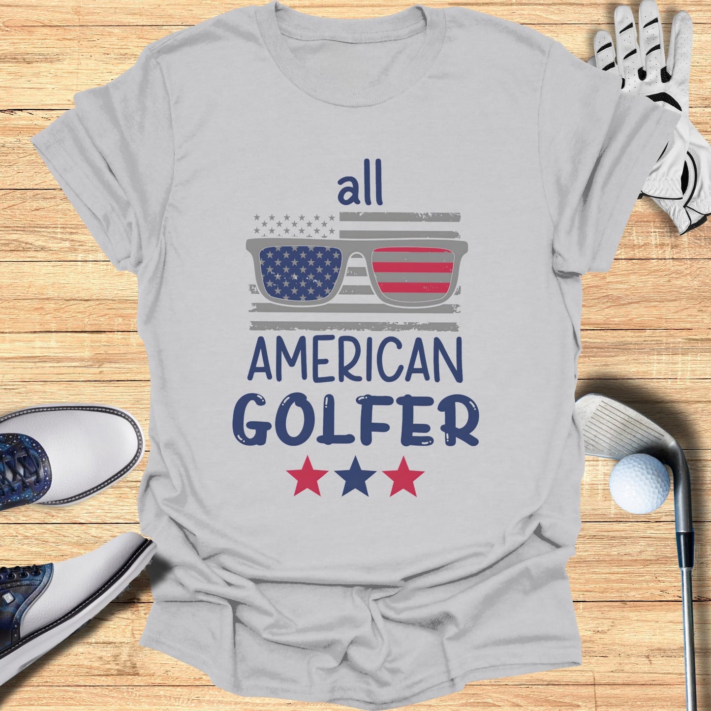 Gray t-shirt with "all AMERICAN GOLFER" and American flag sunglasses.