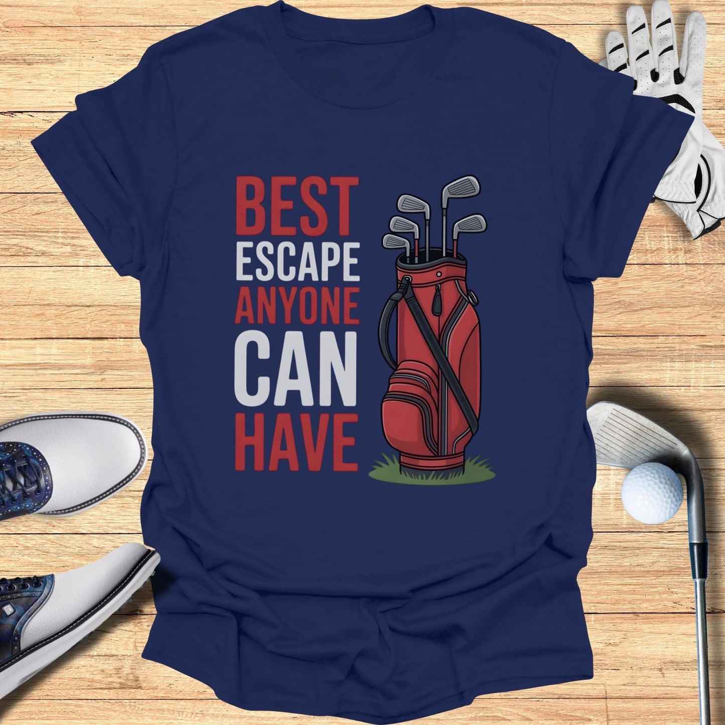Navy t-shirt with "BEST ESCAPE ANYONE CAN HAVE" and golf bag with clubs.