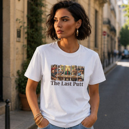 Woman wearing white t-shirt with "The Last Putt" and a painting.