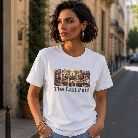 Woman wearing white t-shirt with "The Last Putt" and a painting.