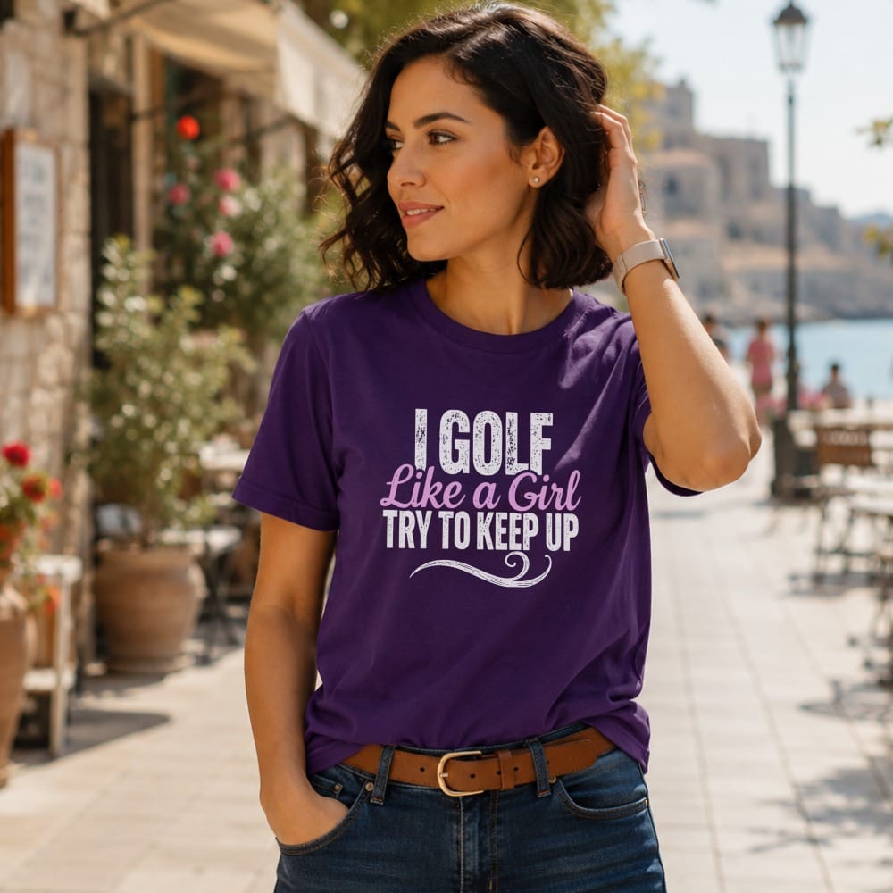 Woman wearing purple t-shirt with "I golf like a girl try to keep up" text.