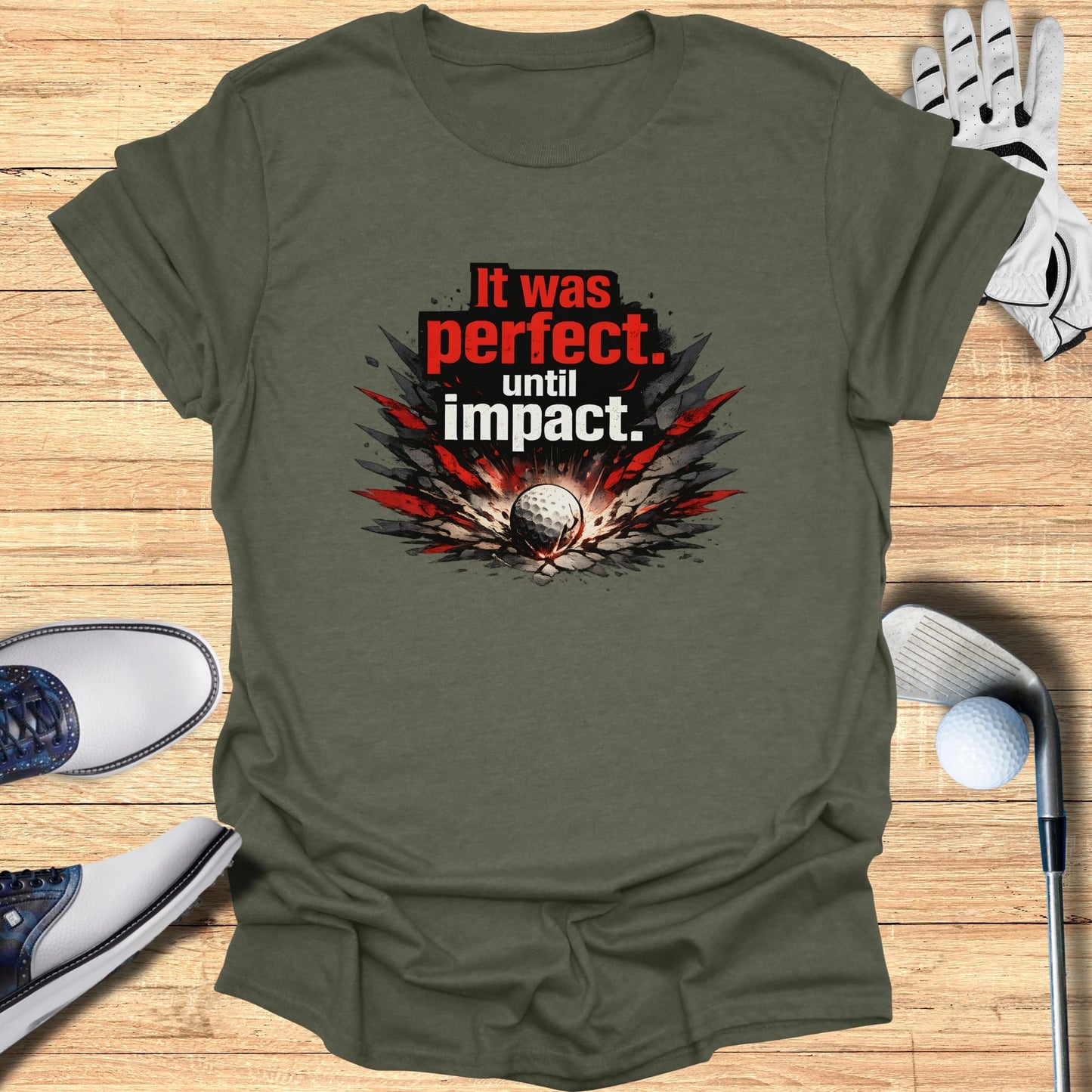 Green t-shirt with "It was perfect. until impact." text and golf imagery.