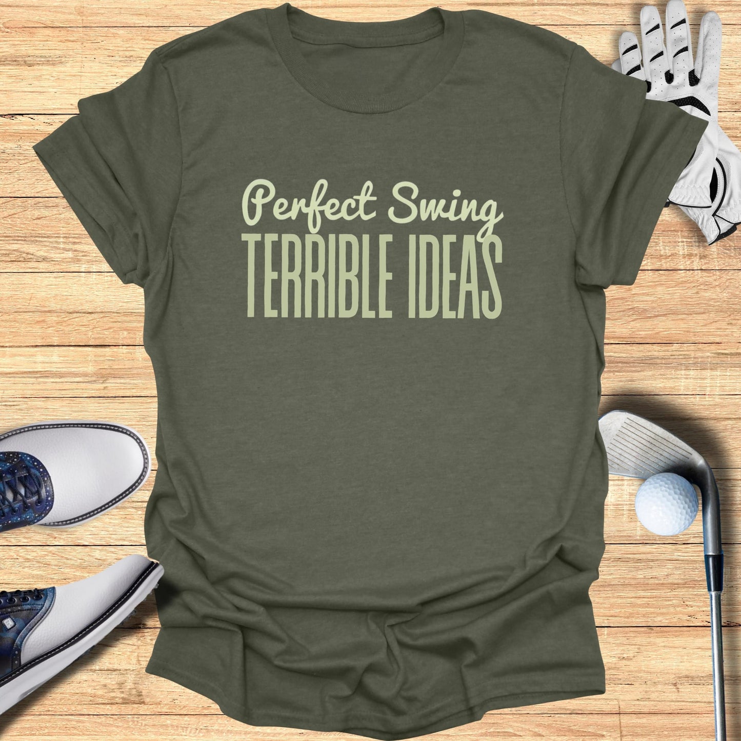 Olive t-shirt with "Perfect Swing TERRIBLE IDEAS" text, golf club, shoes, and glove.