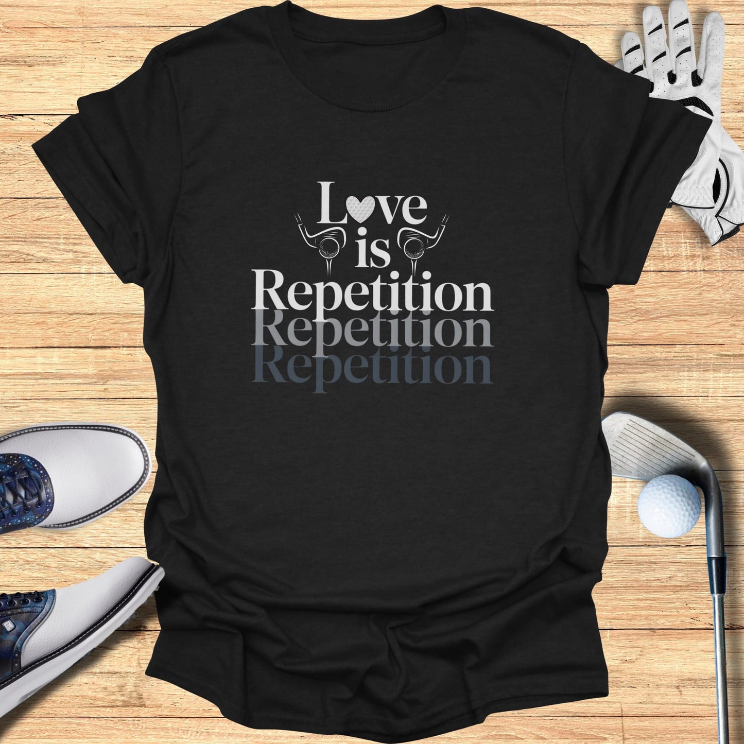 Black t-shirt with "Love is Repetition Repetition Repetition" text.