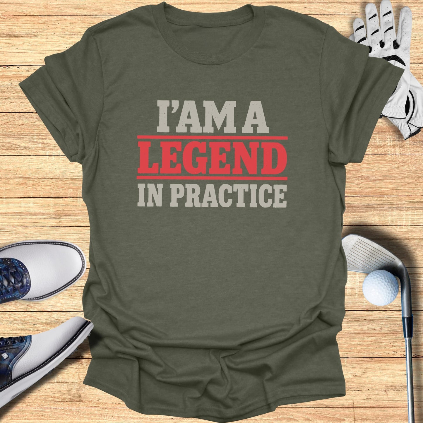 Olive green t-shirt with "I AM A LEGEND IN PRACTICE" in red and gray text.