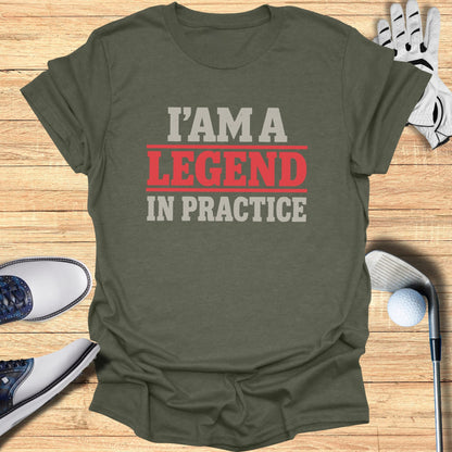 Olive green t-shirt with "I AM A LEGEND IN PRACTICE" in red and gray text.