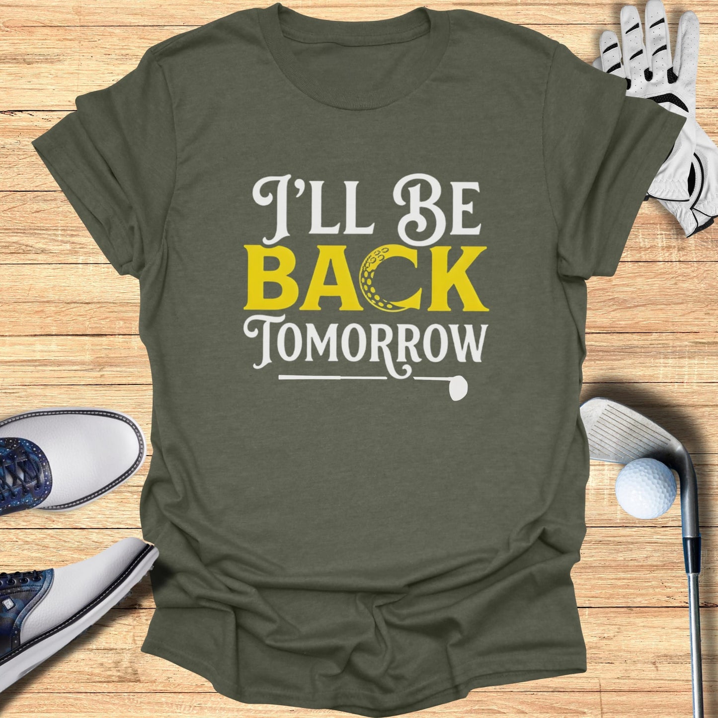Olive green t-shirt with "I'll be back tomorrow" and golf ball graphic.