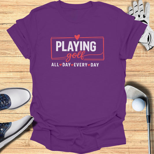 Purple t-shirt with "Playing Golf All Day Every Day" text and heart graphics.