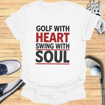 White t-shirt with "GOLF WITH HEART SWING WITH SOUL" text.