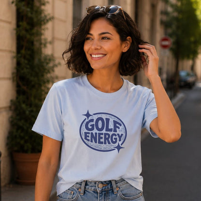 Woman wearing a light blue t-shirt with "GOLF ENERGY" logo and stars.