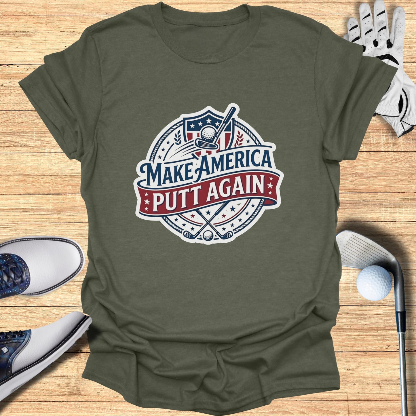 Green t-shirt with "Make America Putt Again" slogan and golf imagery.