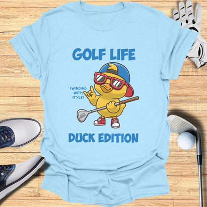 Light blue t-shirt with cartoon duck playing golf and text "Golf Life Duck Edition".
