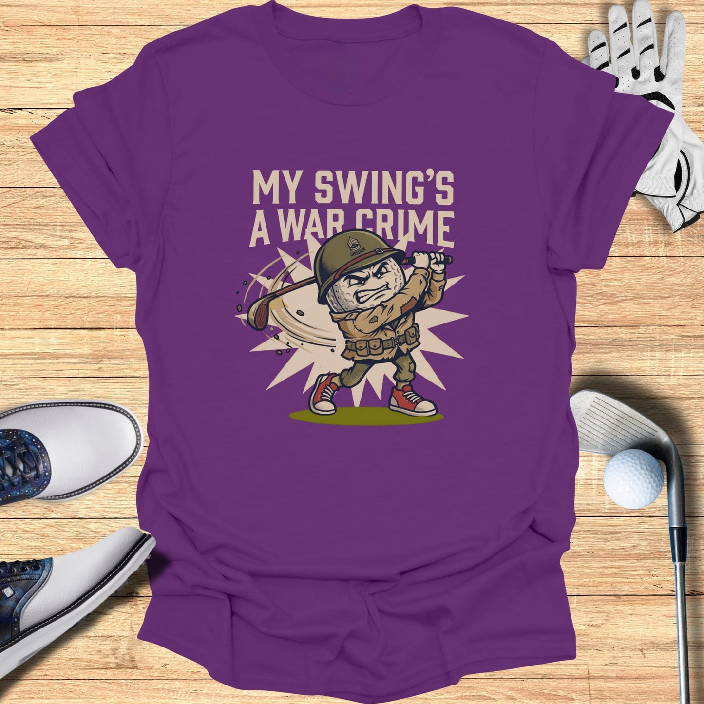 Cartoon soldier swinging golf club with "My swing's a war crime" text.