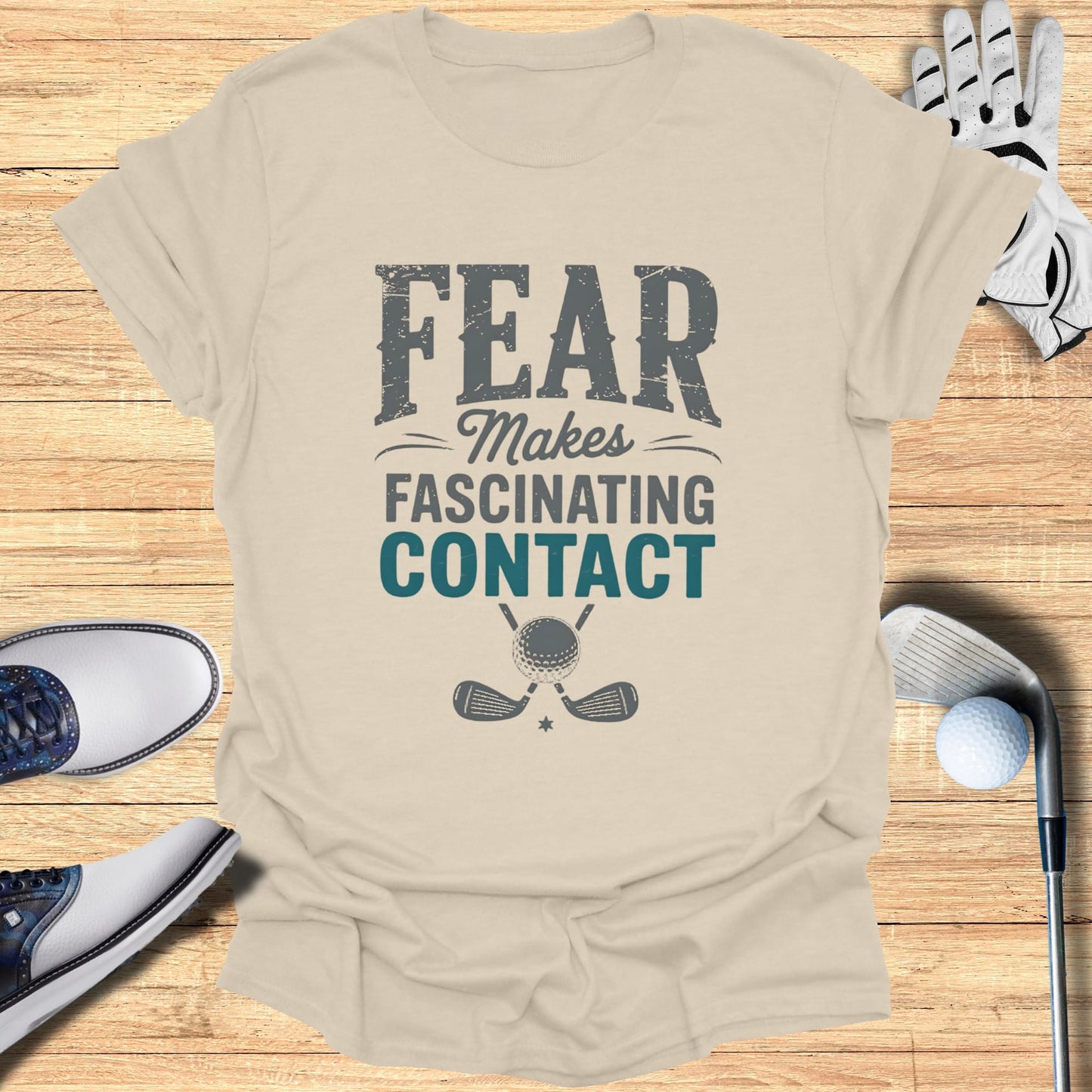 T-shirt with "FEAR MAKES FASCINATING CONTACT" and golf graphic.