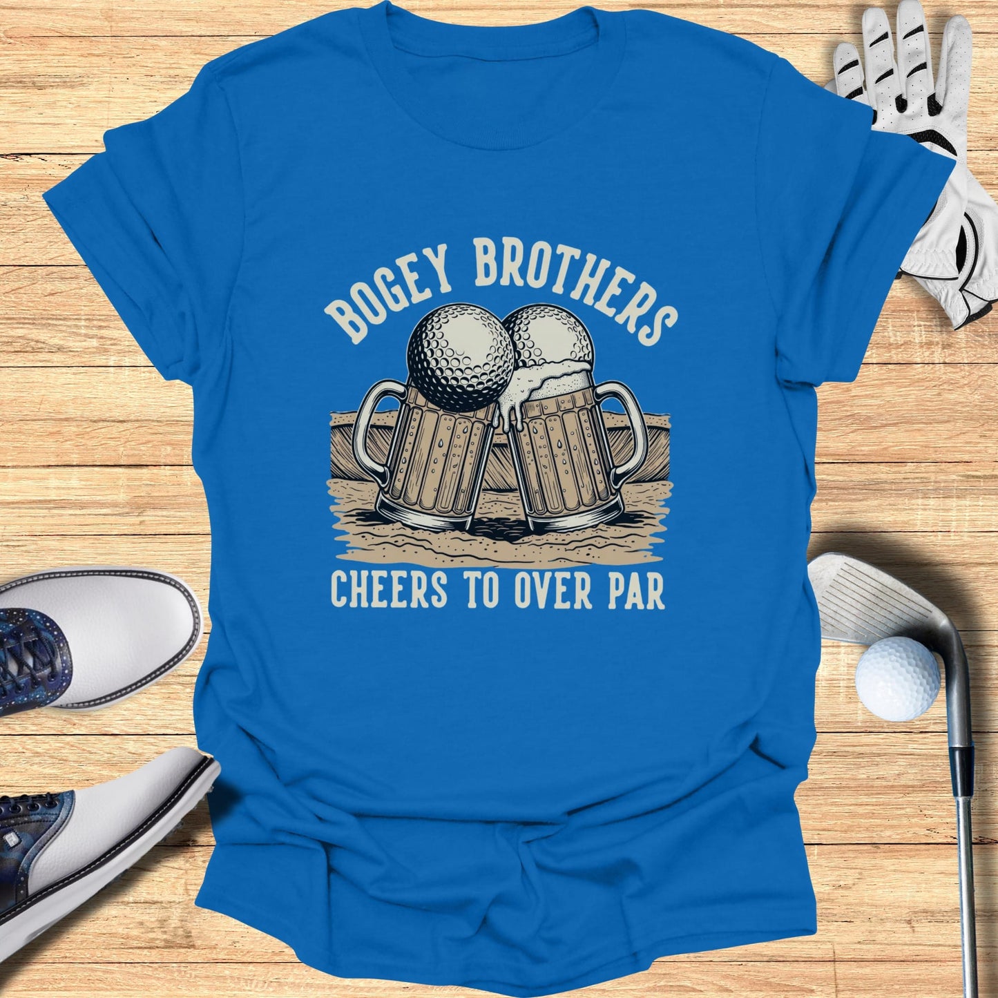 Blue t-shirt with "Bogey Brothers Cheers to Over Par" text and golf ball beer mugs graphic.