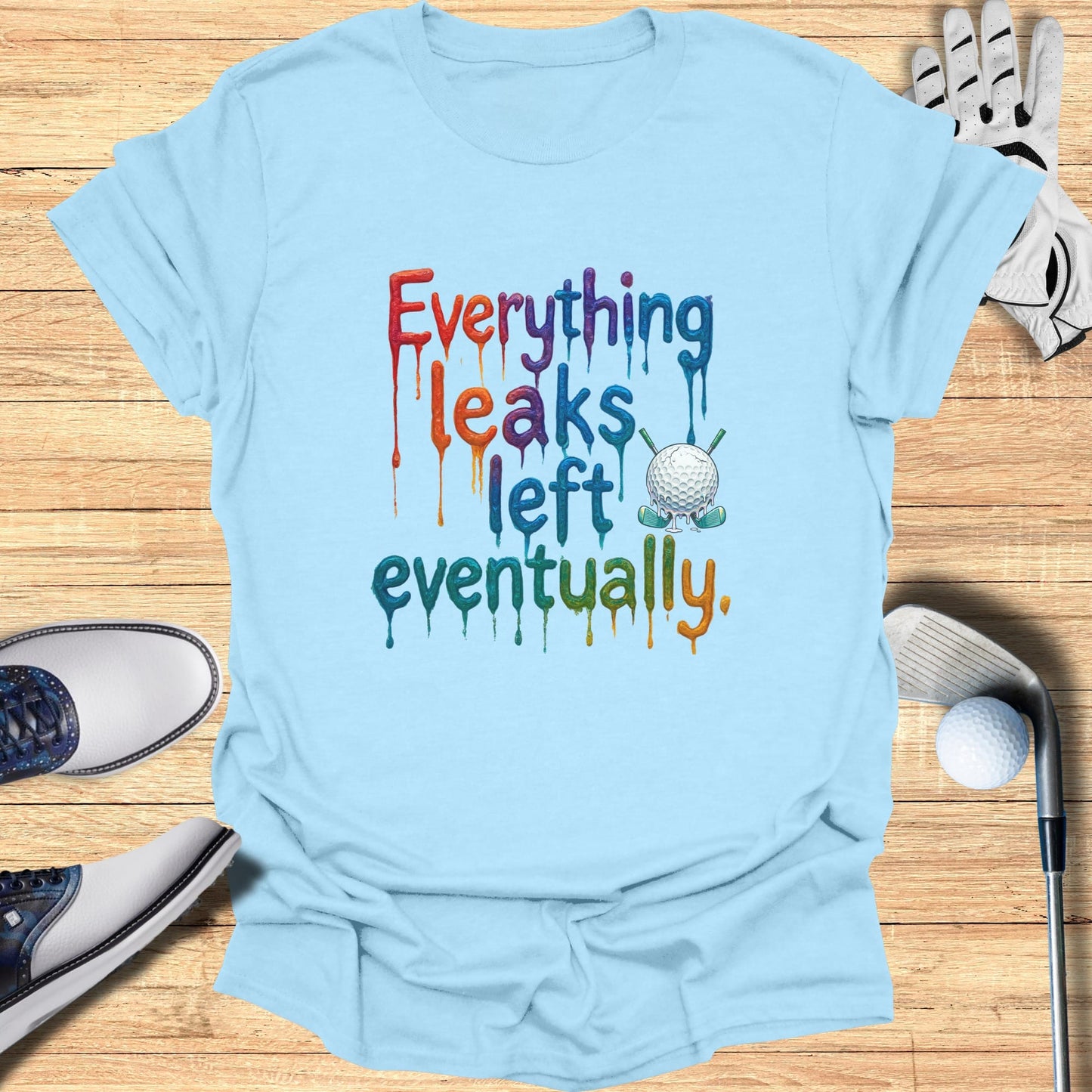 Light blue t-shirt with "Everything leaks eventually" and golf graphic.