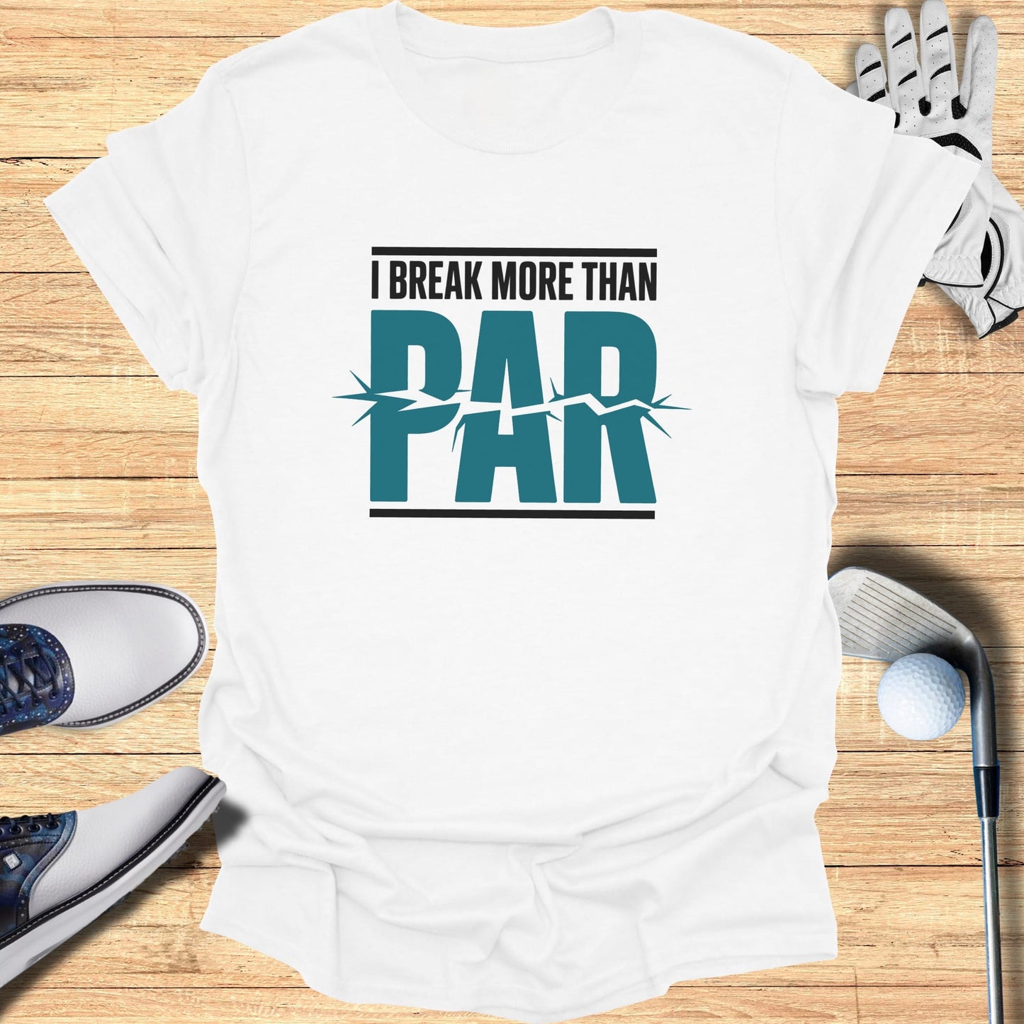 White t-shirt with "I BREAK MORE THAN PAR" text and golf accessories.