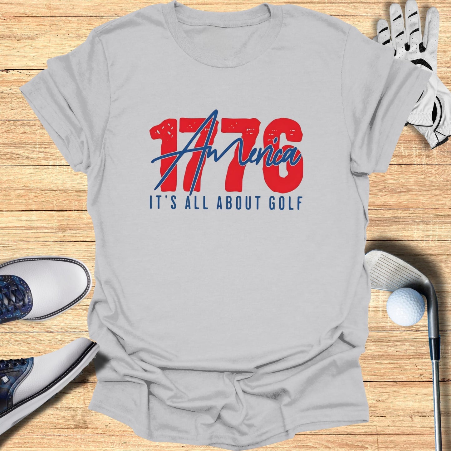 Grey t-shirt with "1776 AMERICA IT'S ALL ABOUT GOLF" graphic.