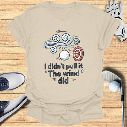 T-shirt with text "I didn't pull the wind did" and golf imagery.