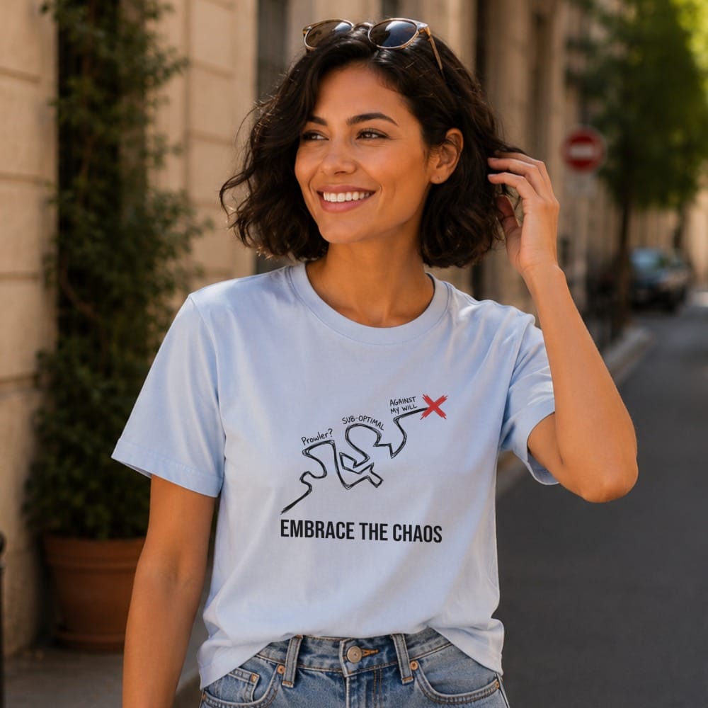 Woman wearing light blue t-shirt with "EMBRACE THE CHAOS" graphic.
