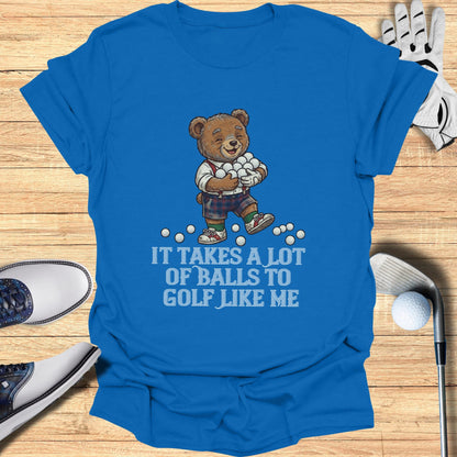 Blue t-shirt with a bear carrying golf balls and text: "It takes a lot of balls to golf like me."