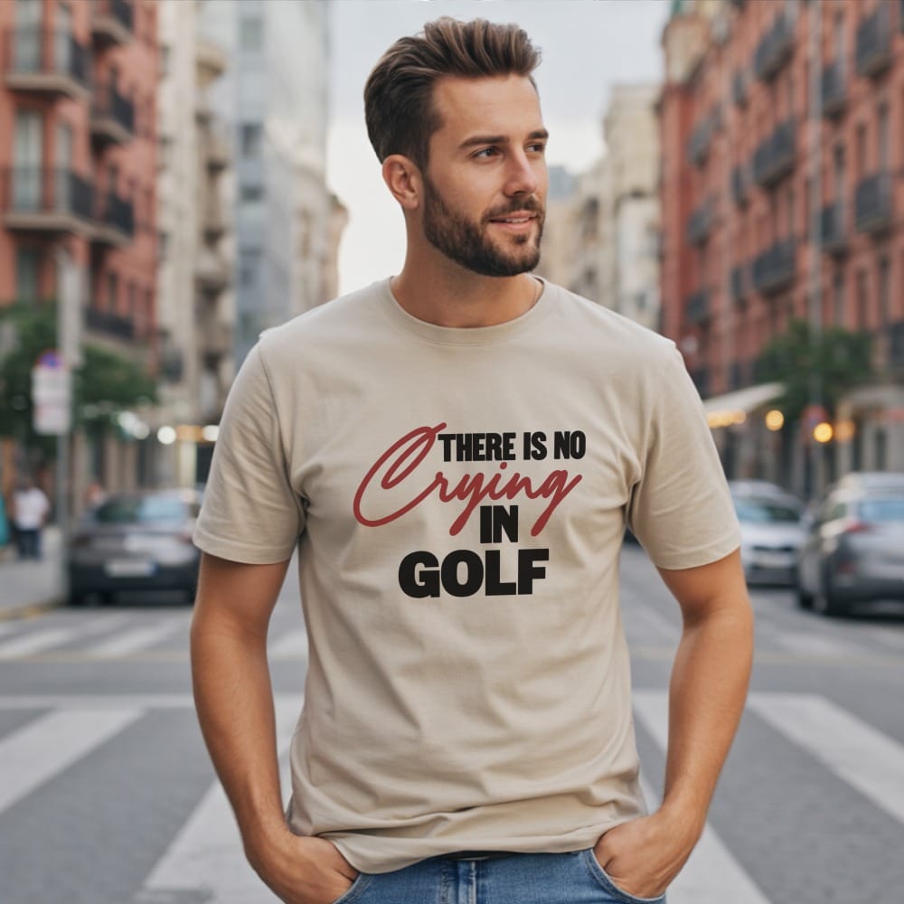 Man wearing a tan t-shirt with "There Is No Crying In Golf" text.