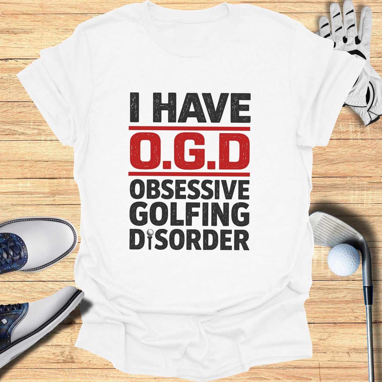 White t-shirt with red and black text that reads "I HAVE O.G.D. OBSESSIVE GOLFING DISORDER."