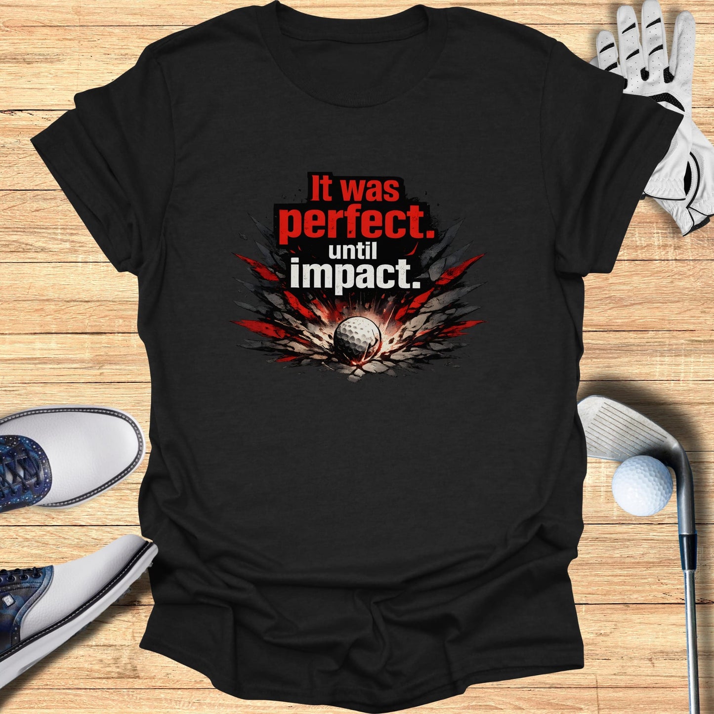 Black t-shirt with red and gray "It was perfect. until impact." graphic and golf ball.