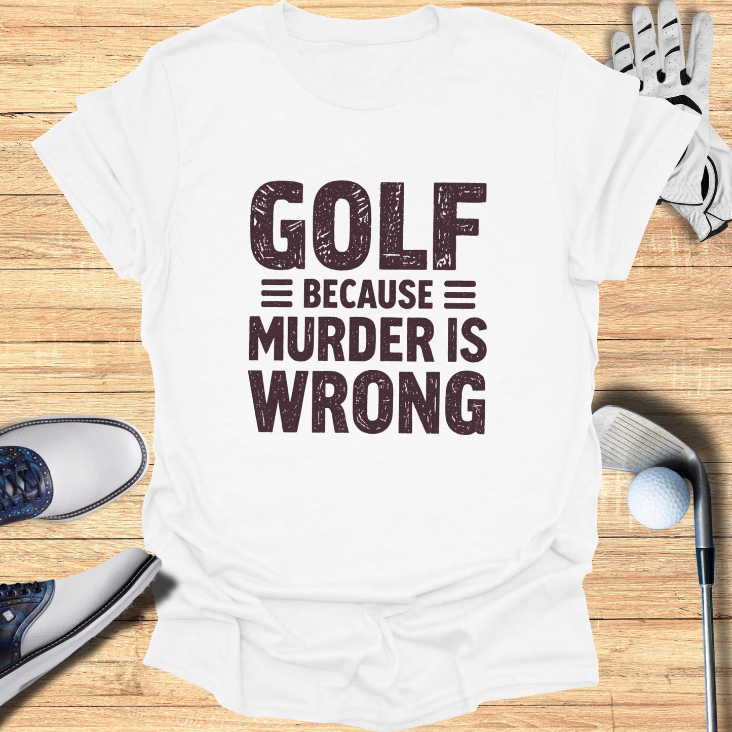 White t-shirt with "GOLF = MURDER IS WRONG" text.