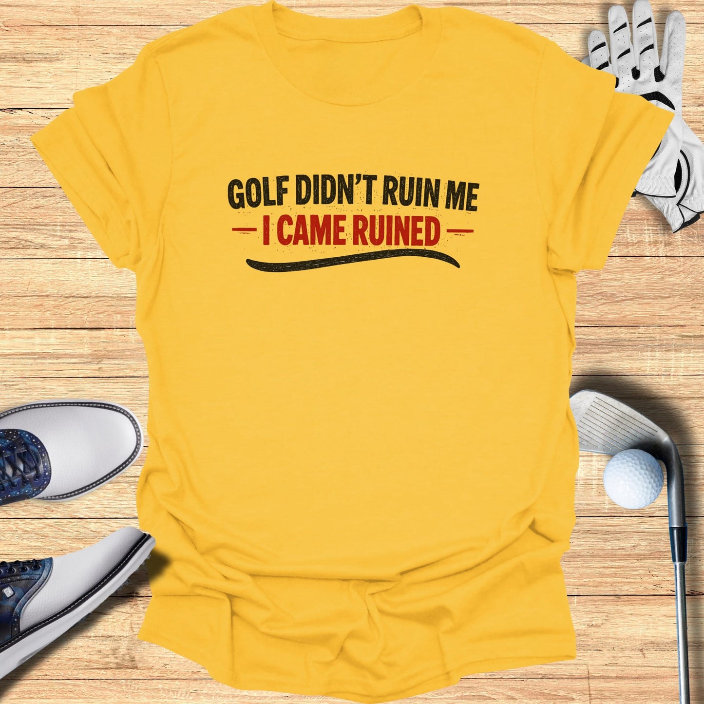 Yellow t-shirt with "Golf Didn't Ruin Me - I Came Ruined" text, golf shoes, and glove.