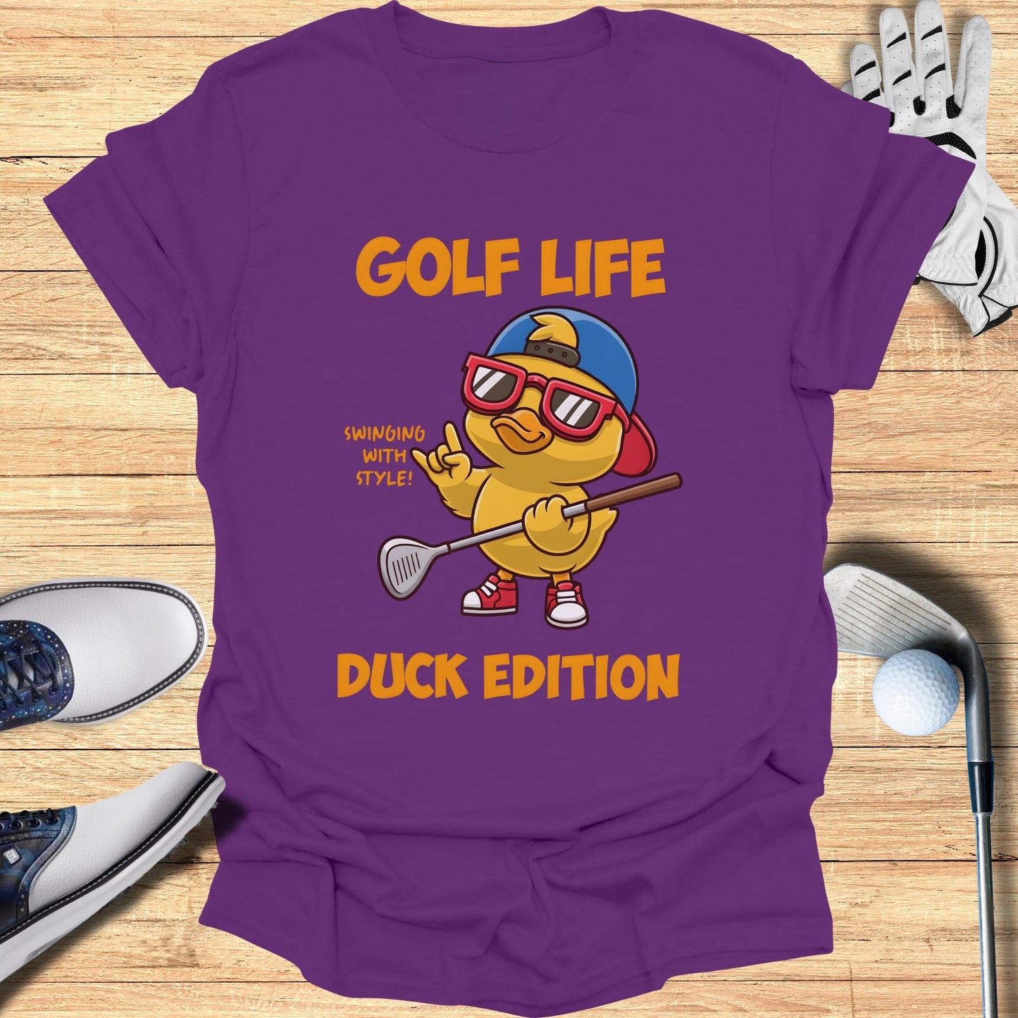 Purple t-shirt with cartoon duck in sunglasses holding golf club, "GOLF LIFE DUCK EDITION".