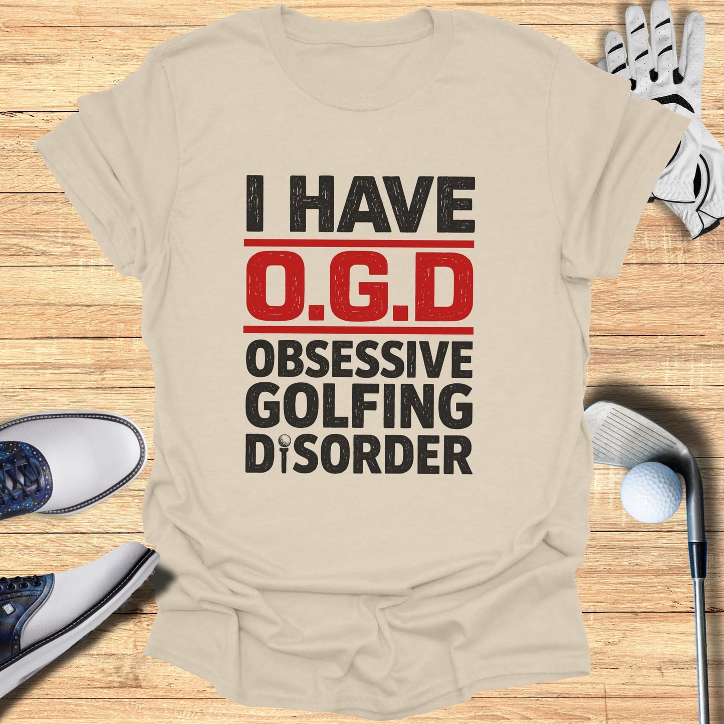 T-shirt with text "I HAVE O.G.D. OBSESSIVE GOLFING DISORDER" with golf accessories.