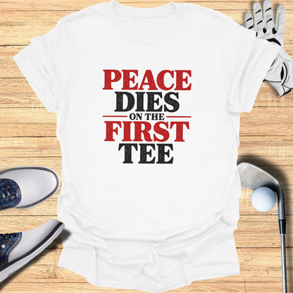 White t-shirt with "Peace Dies on the First Tee" text.