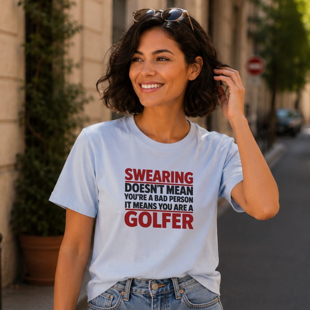 Light blue t-shirt with red and black text reading "SWEARING DOESN'T MEAN YOU'RE A BAD PERSON IT MEANS YOU'RE A GOLFER".