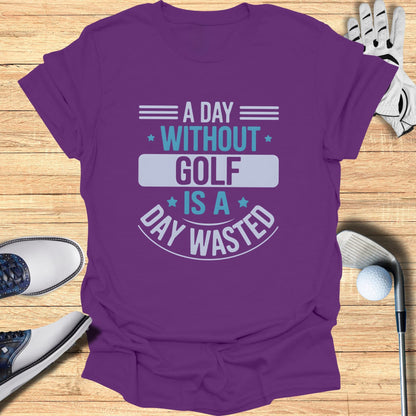 Purple t-shirt with text "A day without golf is a day wasted".
