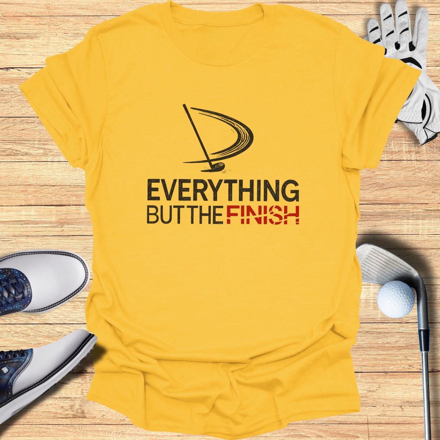 Yellow t-shirt with "EVERYTHING BUT THE FINISH" golf graphic.