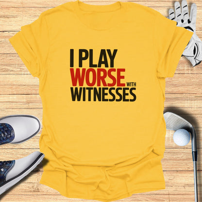 Yellow t-shirt with black and red text "I PLAY WORSE WITH WITNESSES".