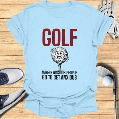 Light blue t-shirt with "GOLF WHERE ANXIOUS PEOPLE GO TO GET ANXIOUS" text and distressed golf ball graphic.