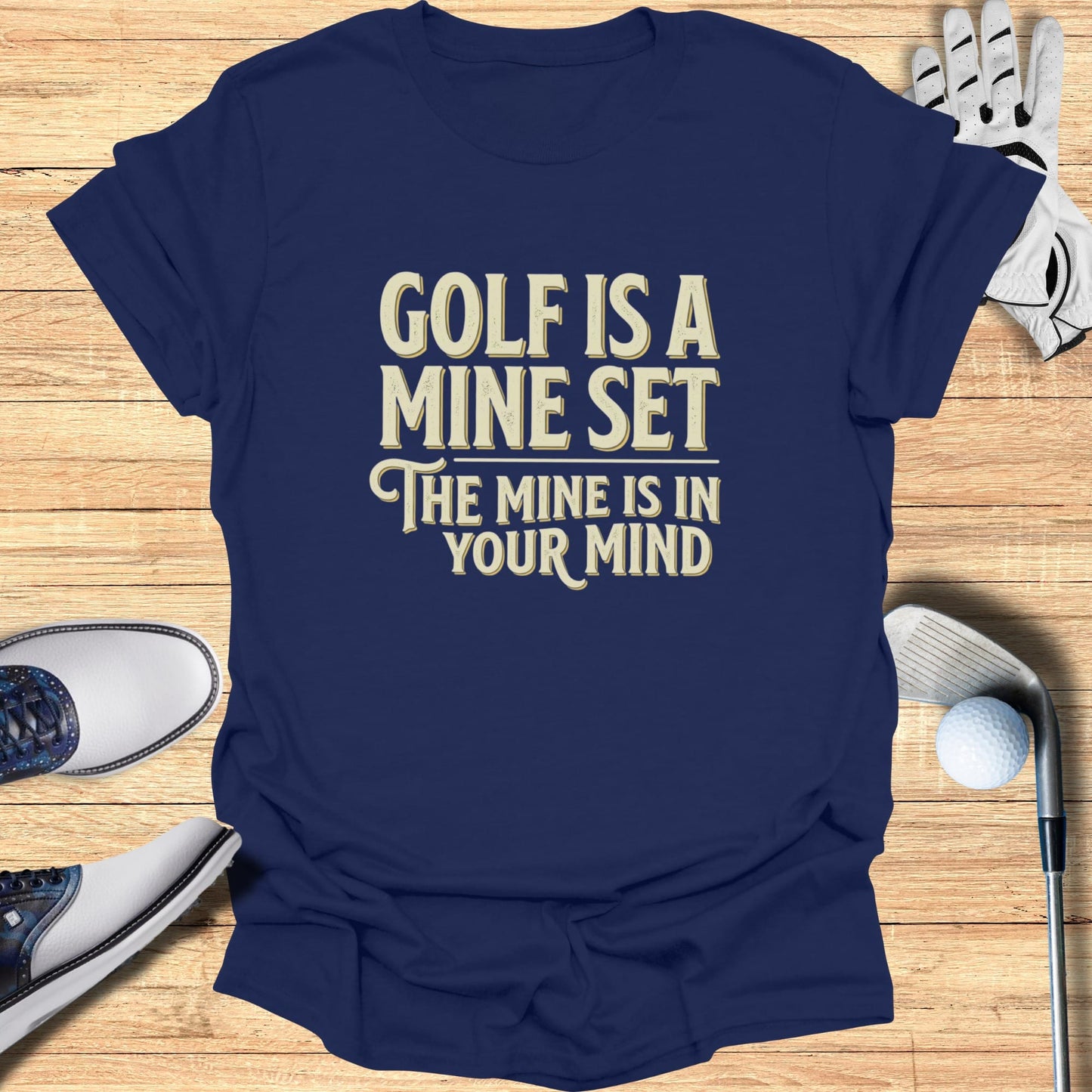Navy t-shirt with "Golf is a mind set, the mind is in your mind" text.