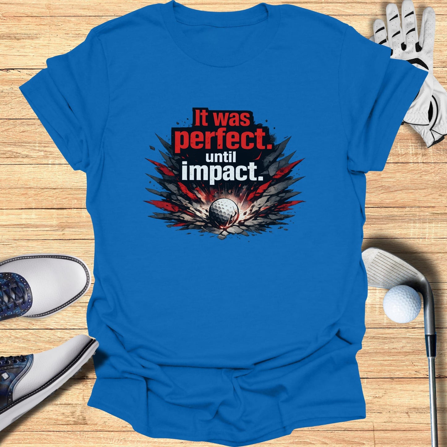 Blue t-shirt with "It was perfect. Until Impact." text and golf imagery.