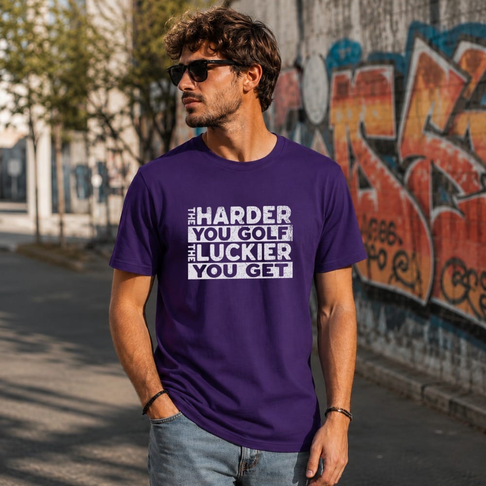 Purple t-shirt with white text: "The harder you golf, the luckier you get."
