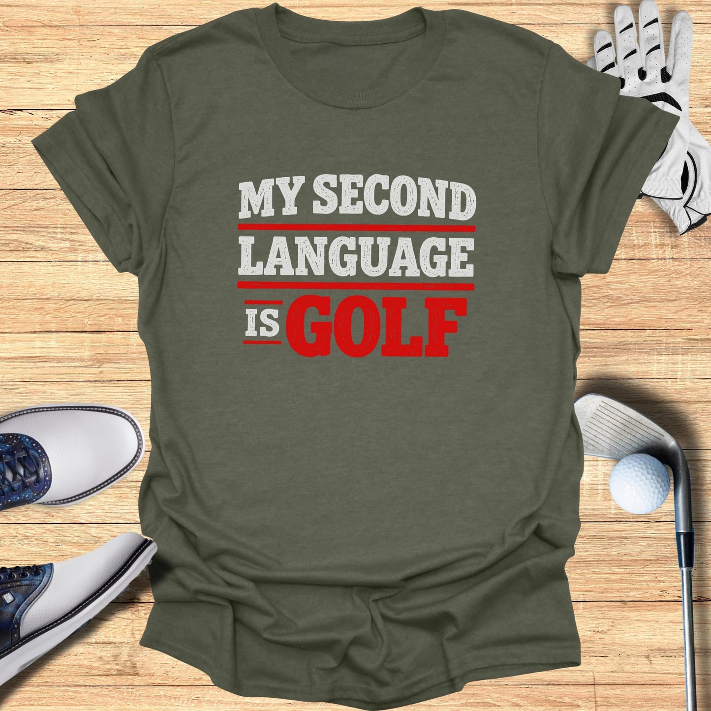 Olive green t-shirt with "MY SECOND LANGUAGE IS GOLF" text.