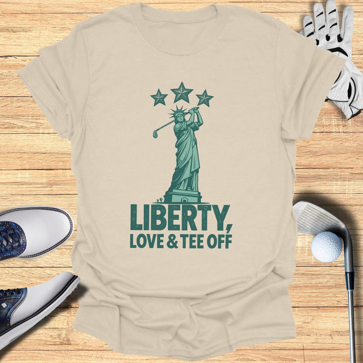 Statue of Liberty swinging a golf club with "Liberty, Love & Tee Off" text.