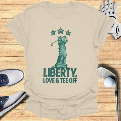Statue of Liberty swinging a golf club with "Liberty, Love & Tee Off" text.