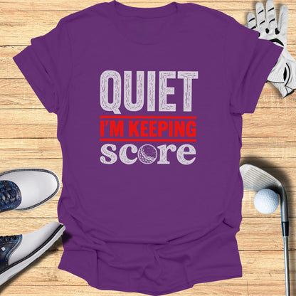 Purple t-shirt with "QUIET I'M KEEPING SCORE" text.