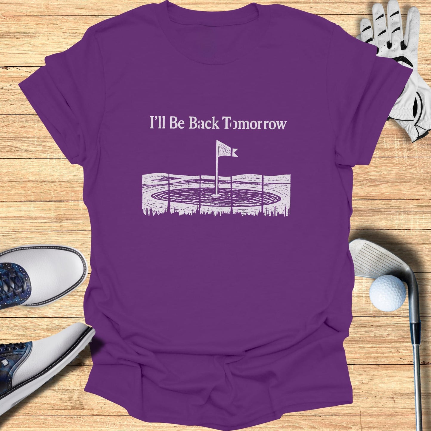 Purple t-shirt with "I'll Be Back Tomorrow" and a golf course graphic.